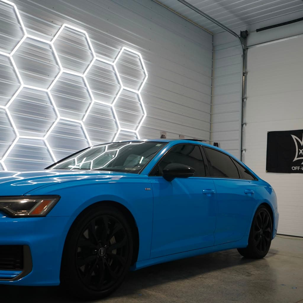 Audi A6 finished in a District 3 Performance blue vehicle wrap