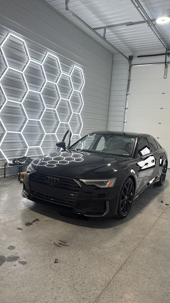 Audi A6 in factory black paint, staged and ready to begin the wrap install